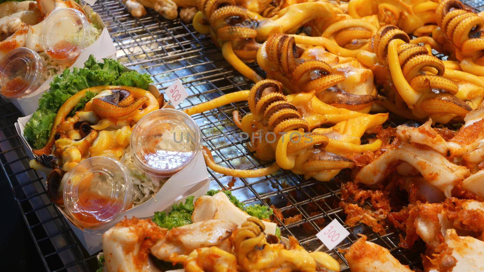 National Asian Exotic ready to eat seafood at night street market food court in Thailand. Delicious Grilled Prawns or Shrimps and other snacks