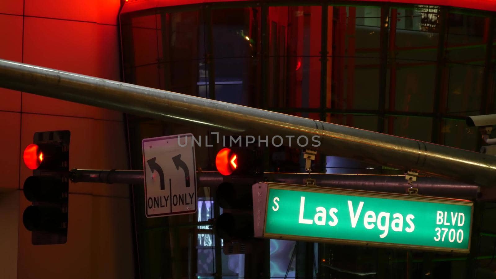 Fabulos Las Vegas, traffic sign glowing on The Strip in sin city of USA. Iconic signboard on the road to Fremont street in Nevada. Illuminated symbol of casino money playing and bets in gaming area by DogoraSun