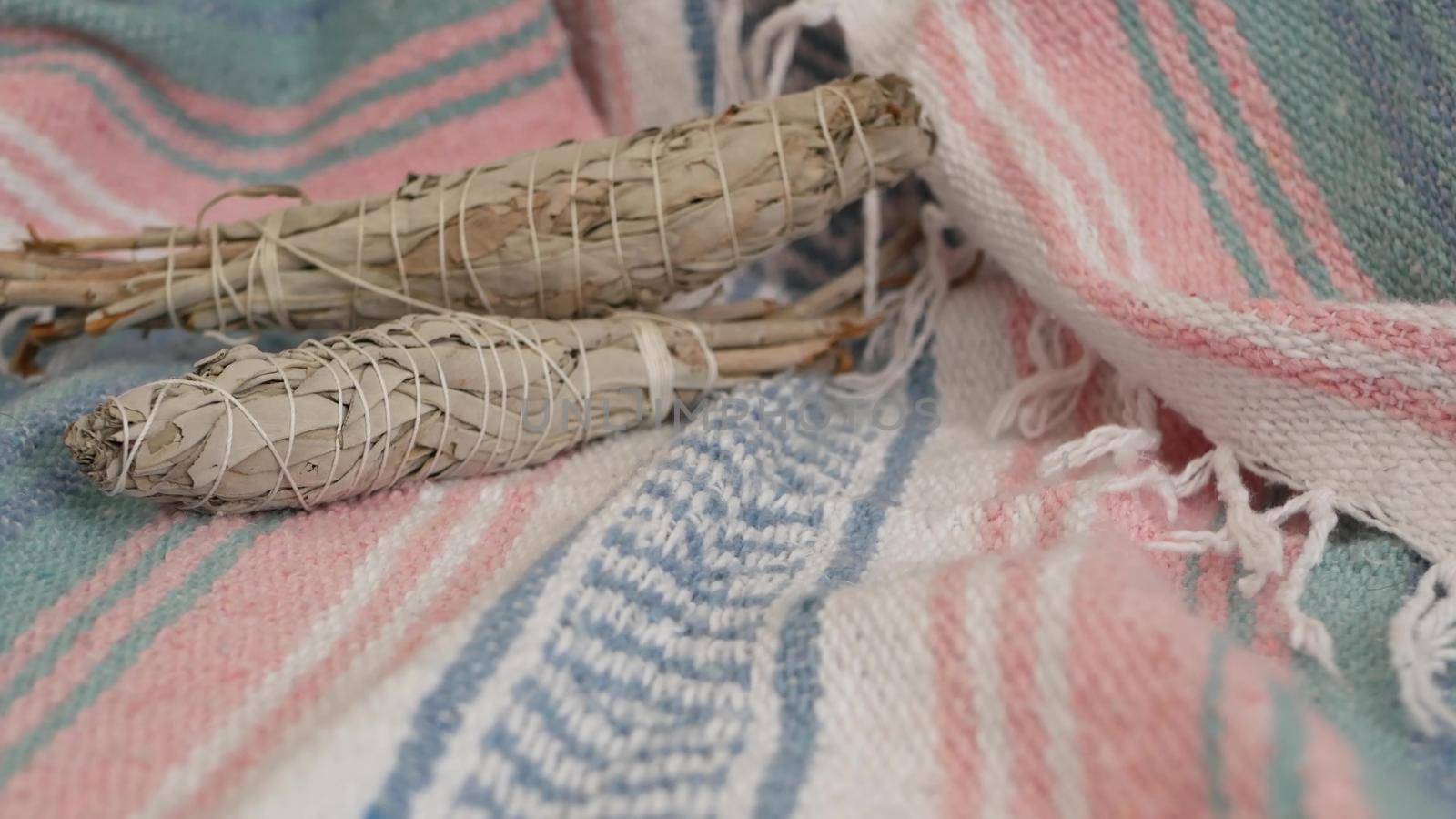 Dried white sage smudge stick, relaxation and aromatherapy. Smudging during psychic occult ceremony, herbal healing, yoga or aura cleaning. Essential incense for esoteric rituals and fortune telling.