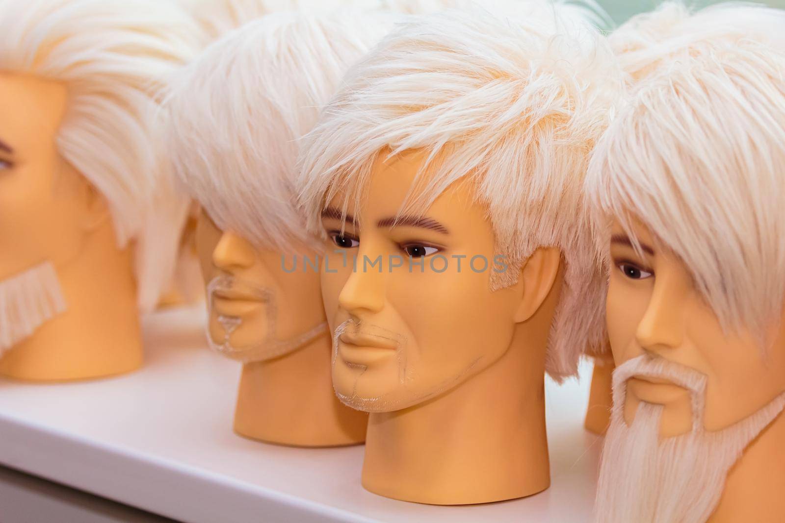 Male mannequins for training hairstyles. Male images with a beard and mustache, close-up.