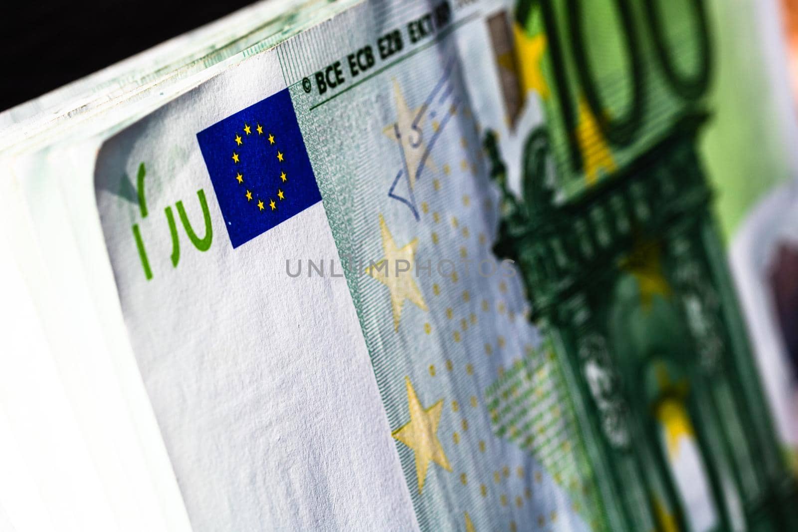 Selective focus on detail of euro banknotes. Close up macro detail of money banknotes, 100 euro isolated. World money concept, inflation and economy concept