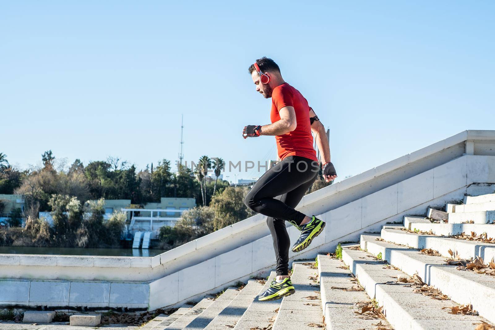man running down a flight of stairs and listening to music