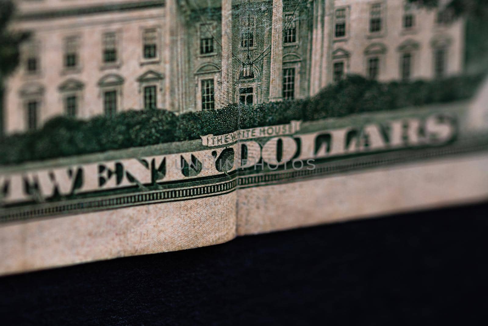 Selective focus on detail of 20 dollars banknote. Close up macro detail of money banknotes, dollars isolated. World money concept, inflation and economy concept