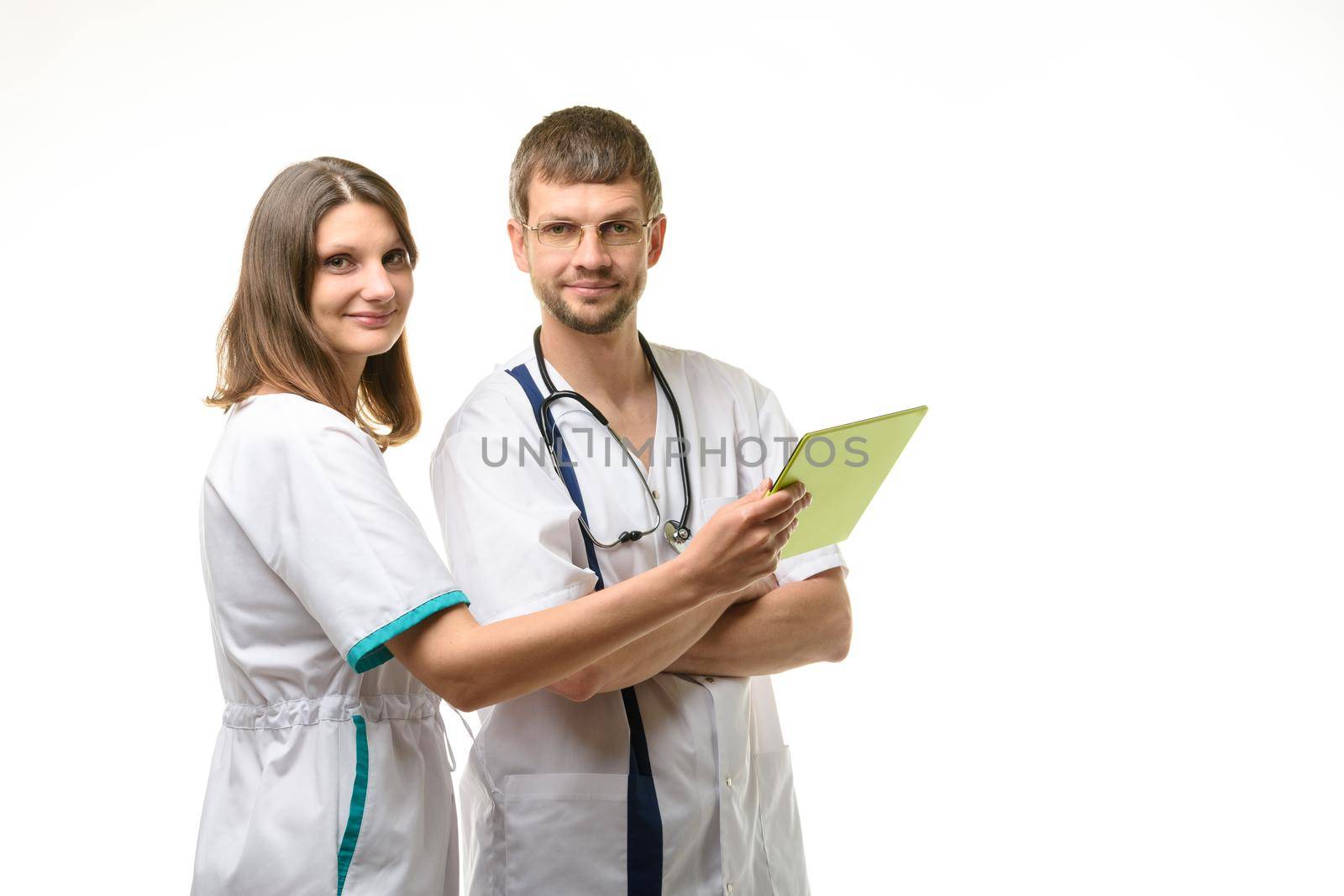 Two doctors discuss the test results and looked at the frame