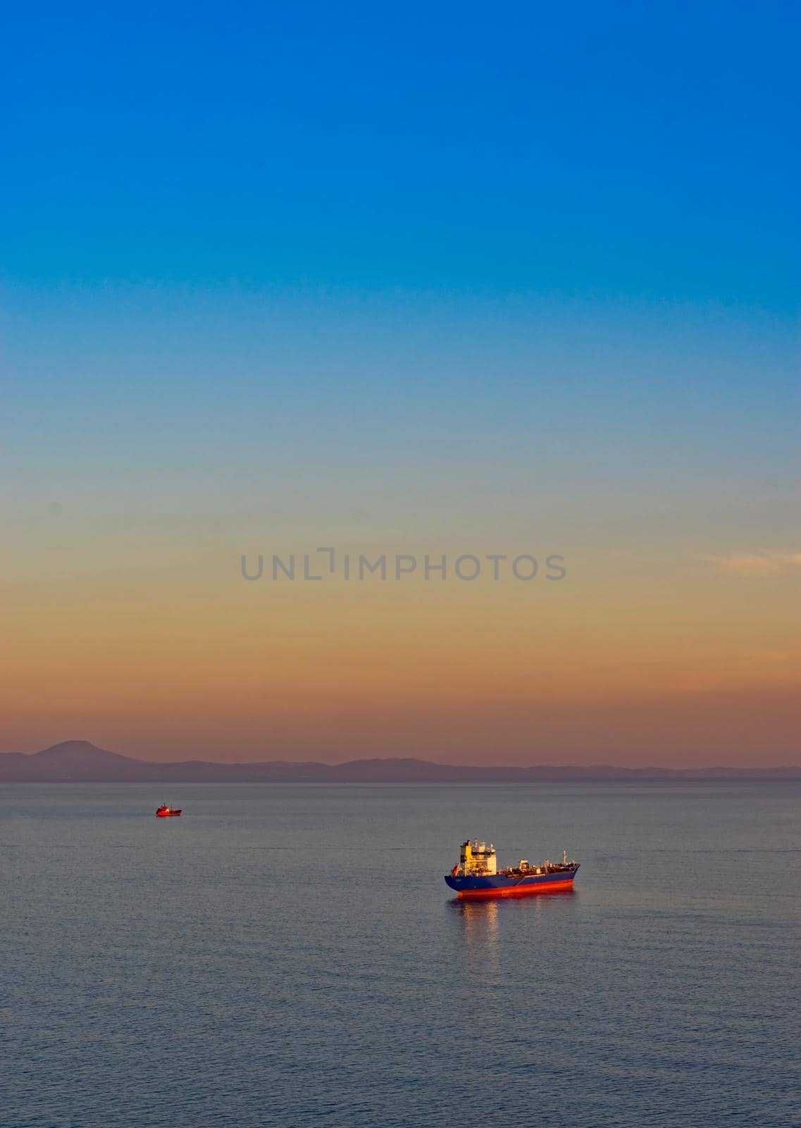 Seascape with tanker and ships on the background of the sea and coastline. Vladivostok, Russia