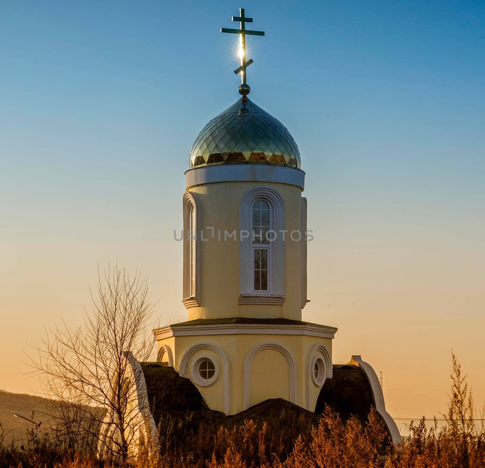 Golden dome of the church on the background of the sunset. Russian Island, Vladivostok