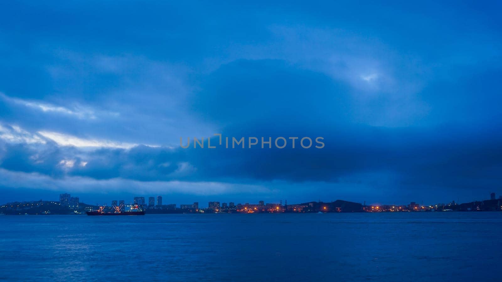 Seascape with coastline in blue hour. Vladivostok, Russia