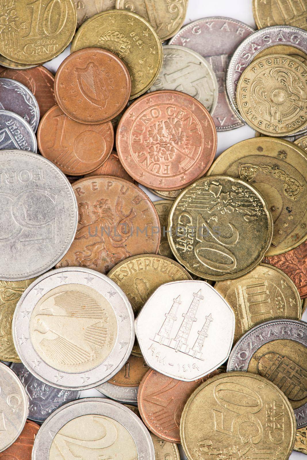 old coins of different countries on a white by aprilphoto