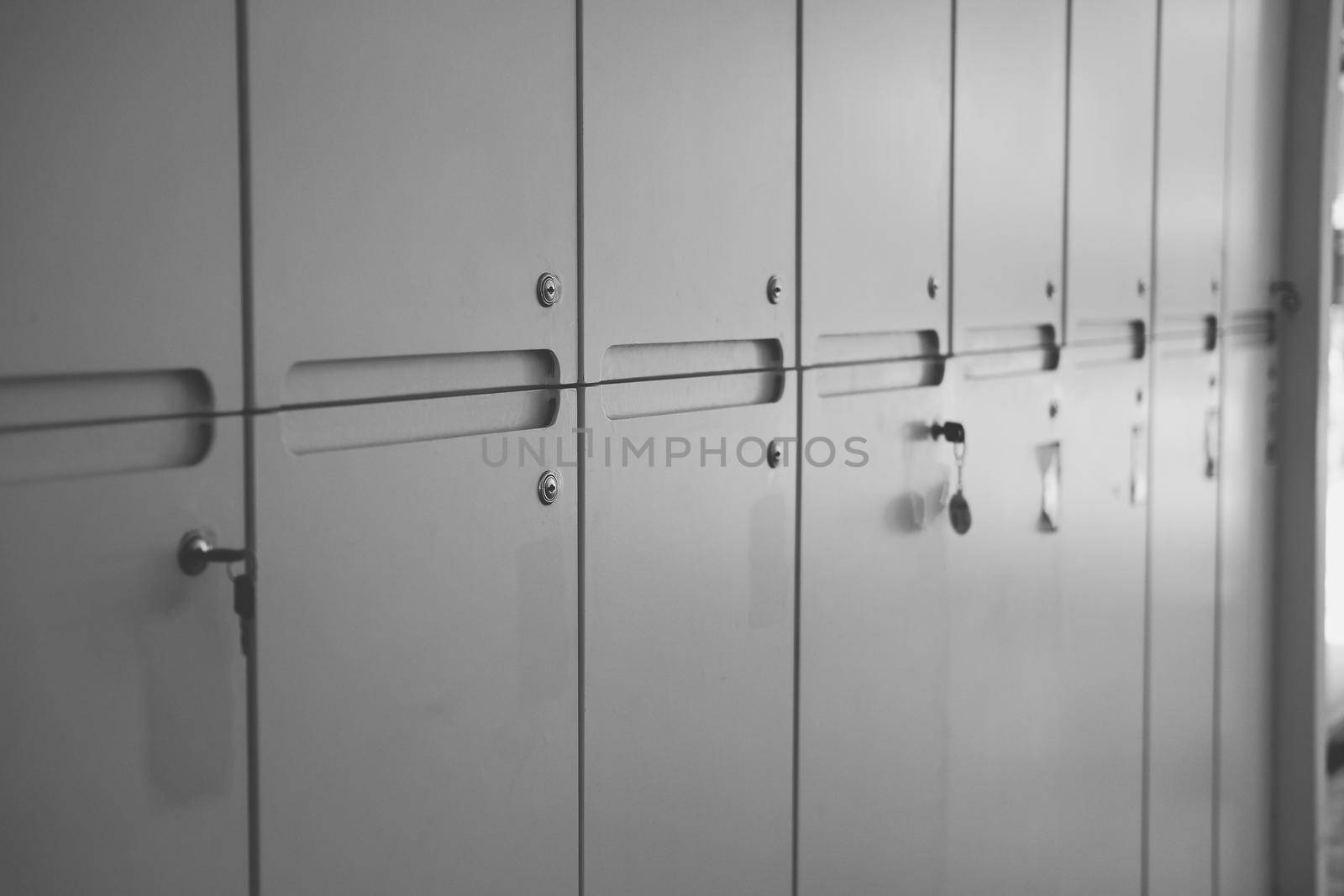 white school lockers and key in locker room