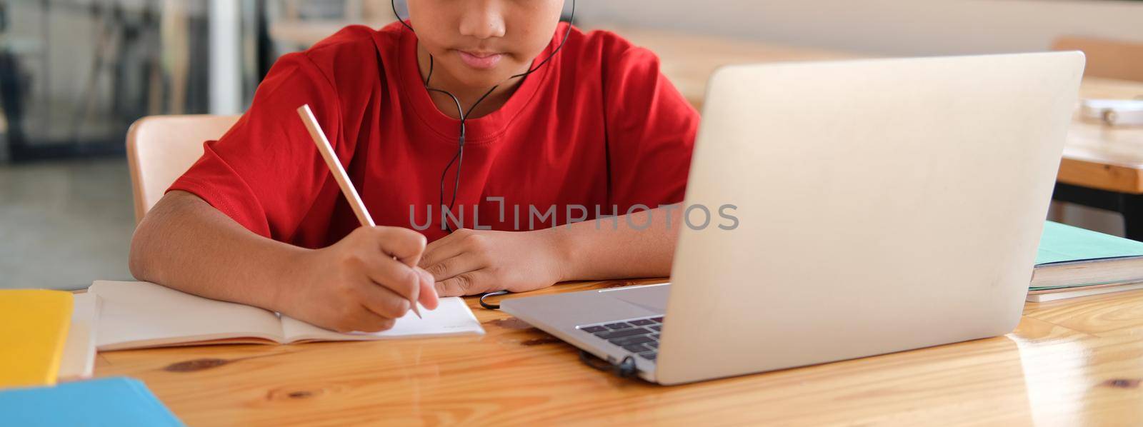 asian boy student studying learning lesson online. remote meeting distance education at home