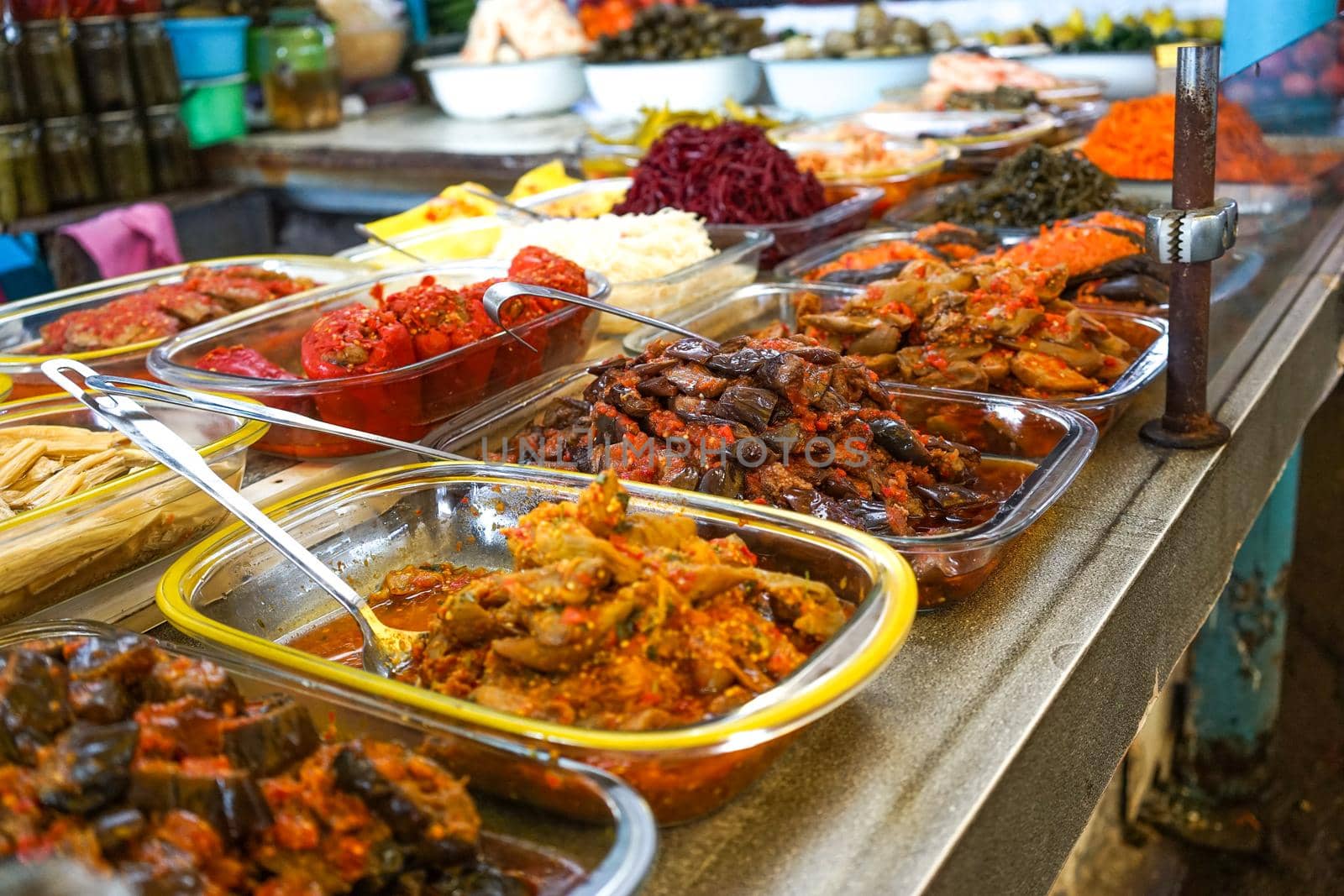 Products of the Yalta market, pickles of vegetables on the counter for sale.