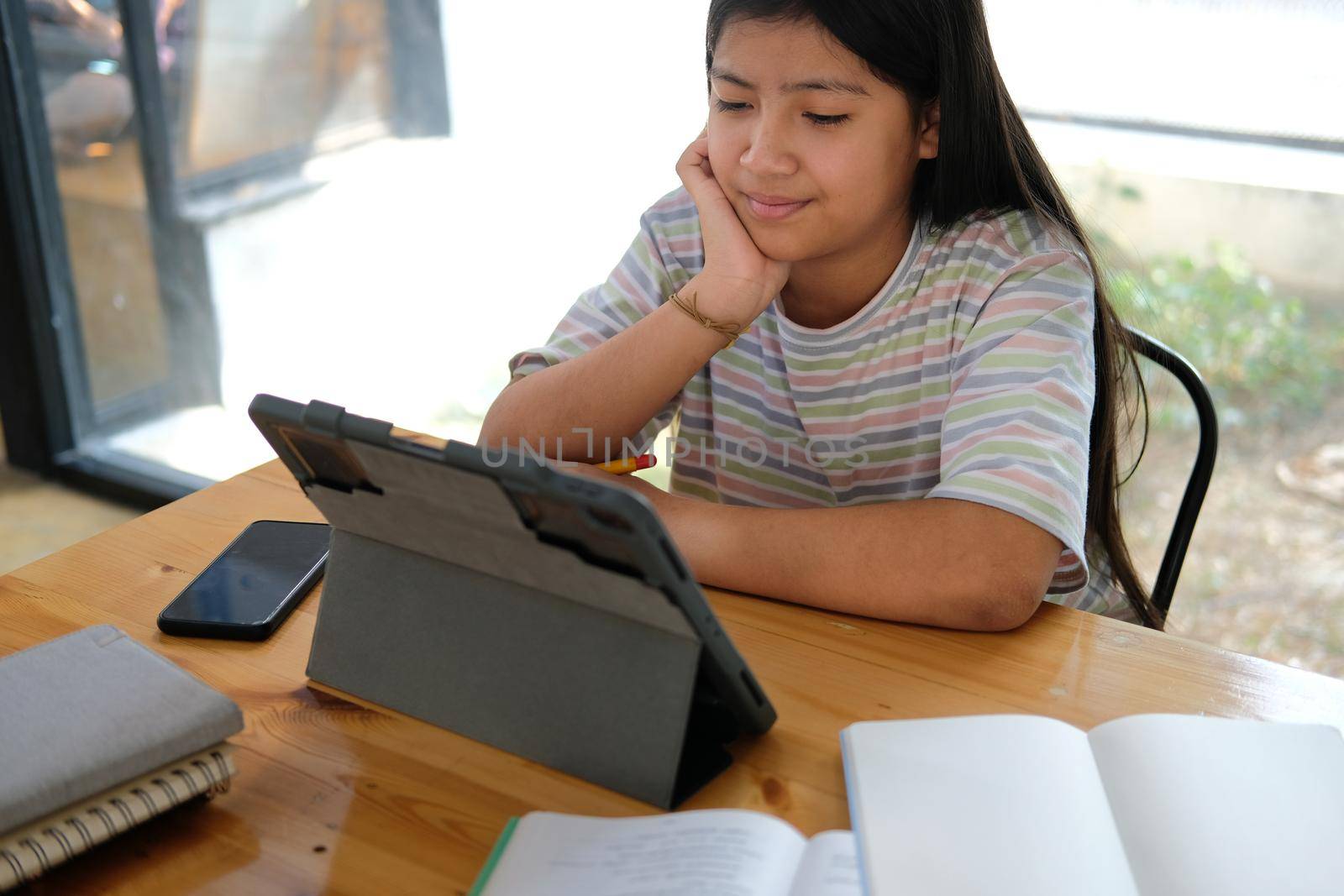 asian girl student studying learning lesson online. remote meeting distance education at home