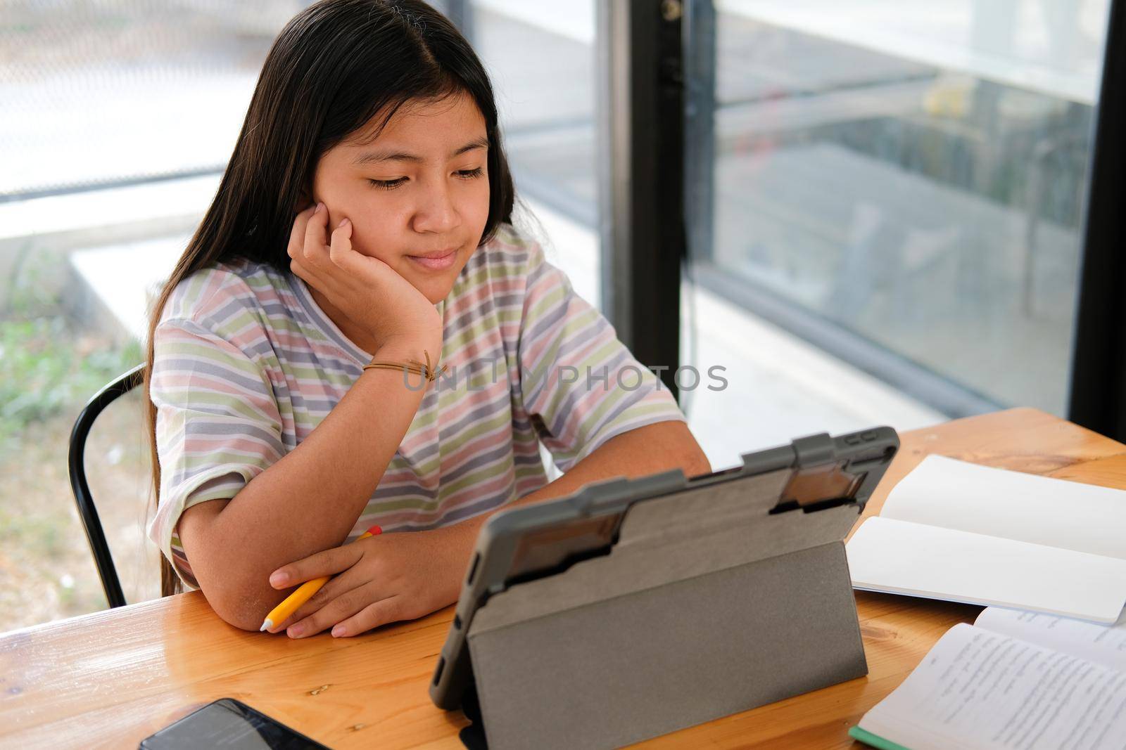asian girl student studying learning lesson online. remote meeting distance education at home