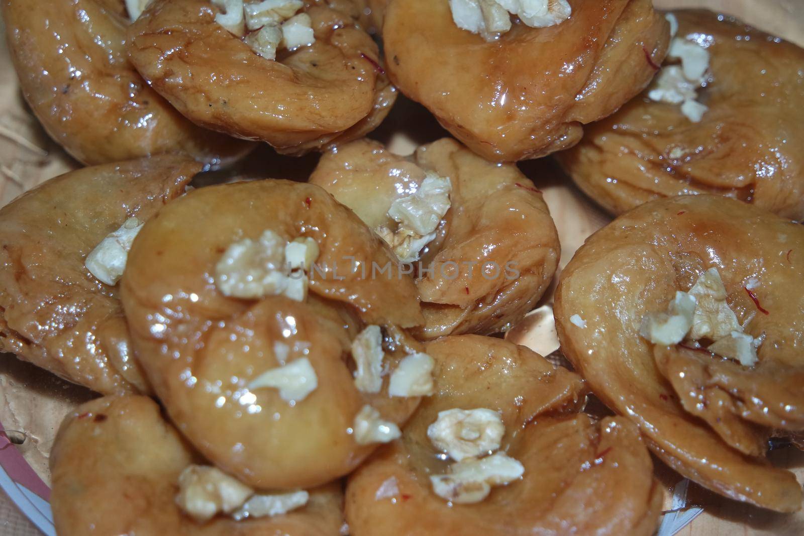 Closeup of delicious and tasty Asian sweet dish called balu shahi or baloshahi. by Photochowk