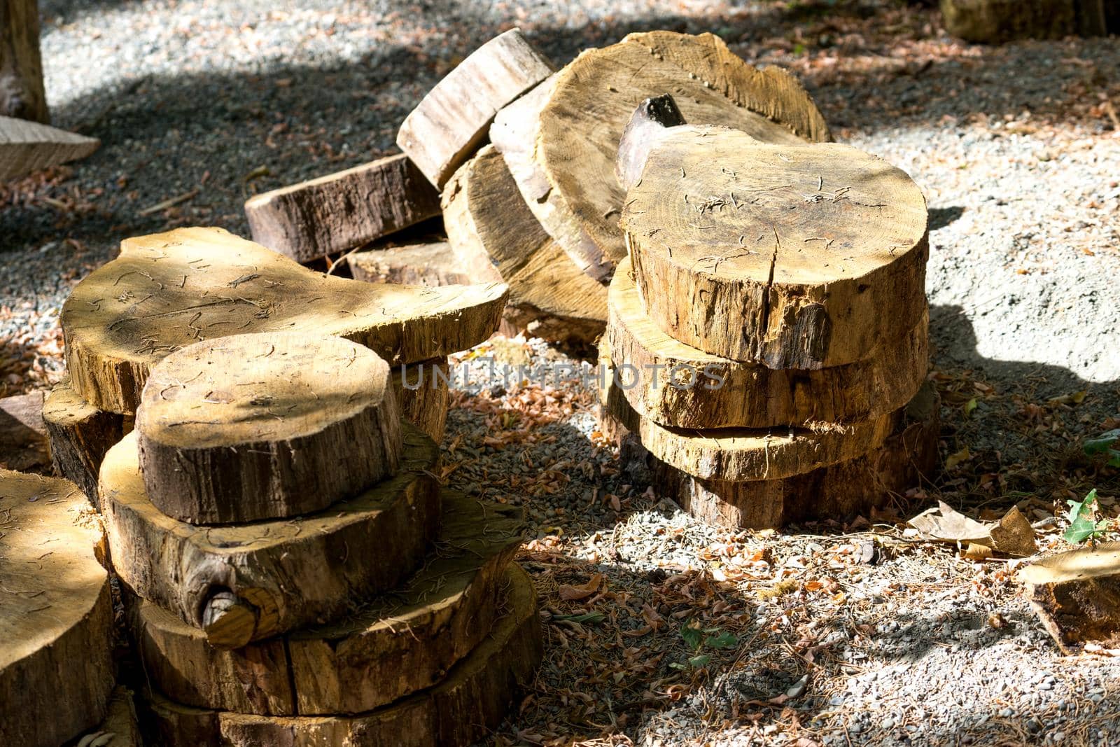 natural background with wooden dice and pieces of tree trunks