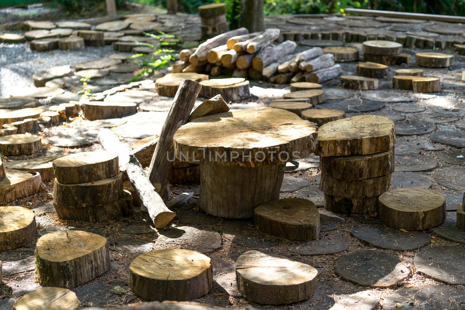 natural background with wooden dice and pieces of tree trunks