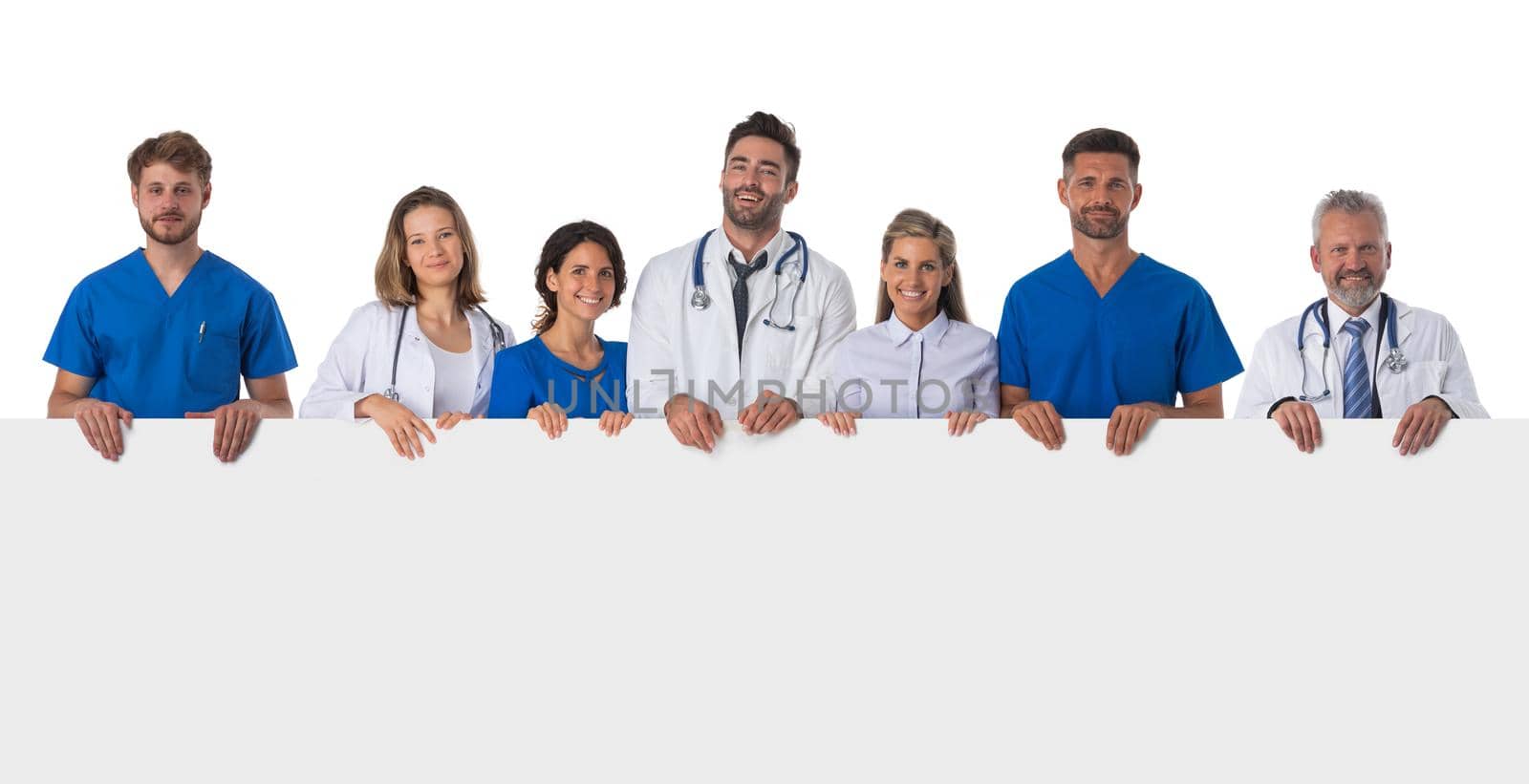 Group of medical doctors holding blank banner ad isolated on white background