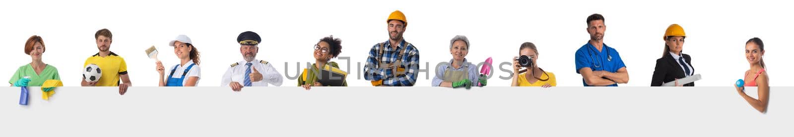 Group of diverse professionals holding blank banner ad isolated on white background