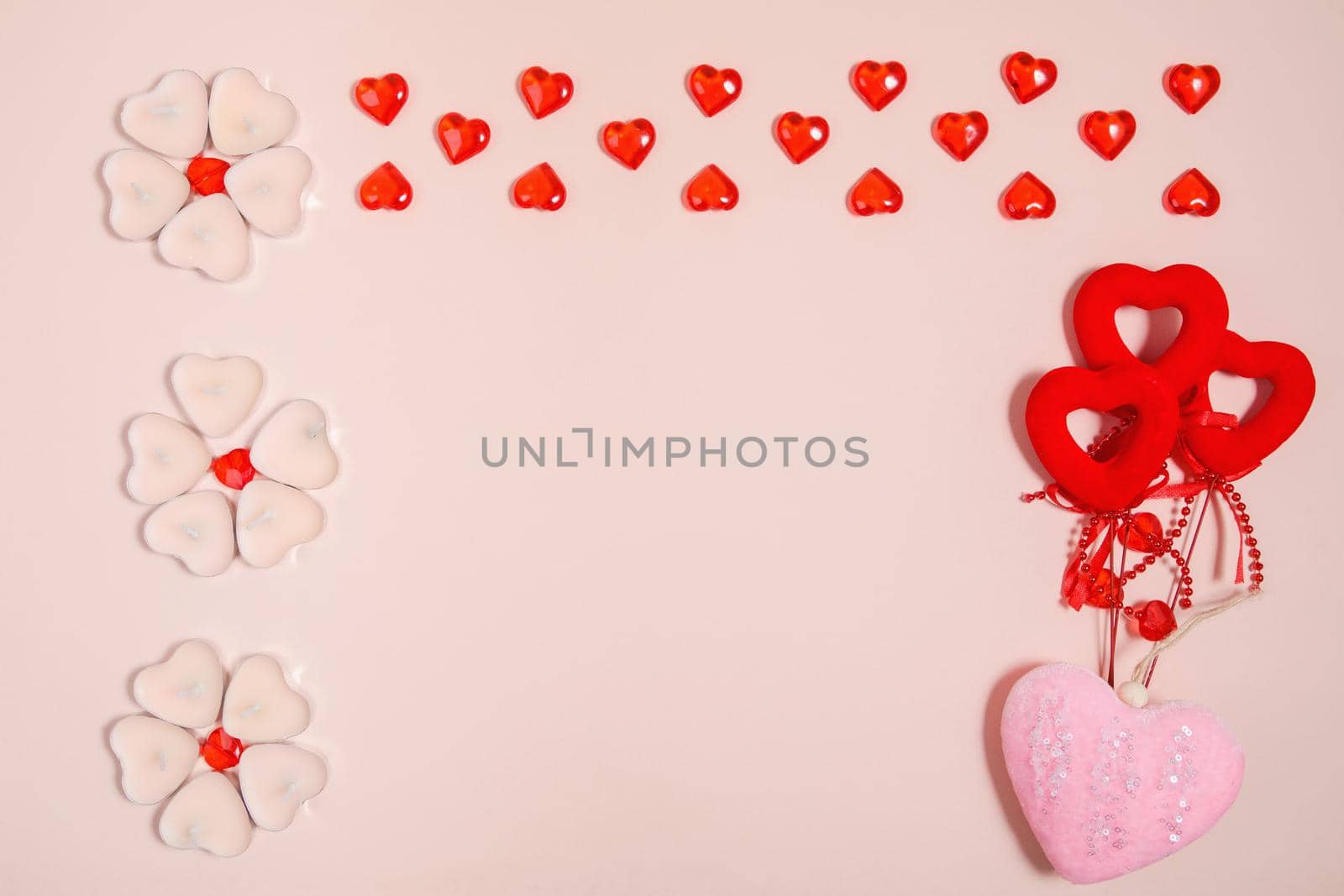 Valentine's Day, composition of hearts on a pink background. View from above. Space for text, flat lay