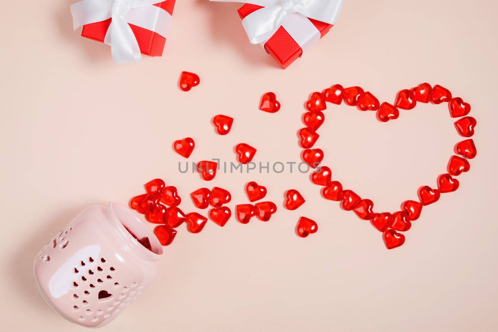 Valentine's Day, composition of hearts on a pink background. View from above. Space for text, flat lay