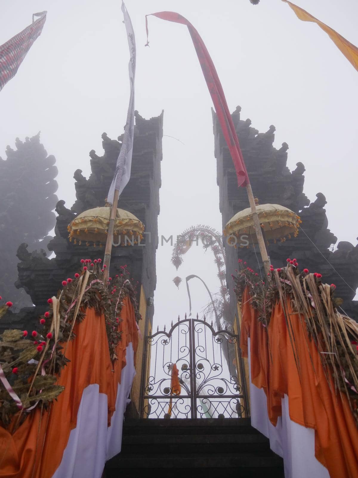 Hindu temple gate in the fog, Ulun Danu Batur, Bali,Indonesia. Balinese Hindu Temple, old hindu architecture, Bali Architecture, Ancient design. Travel concept.