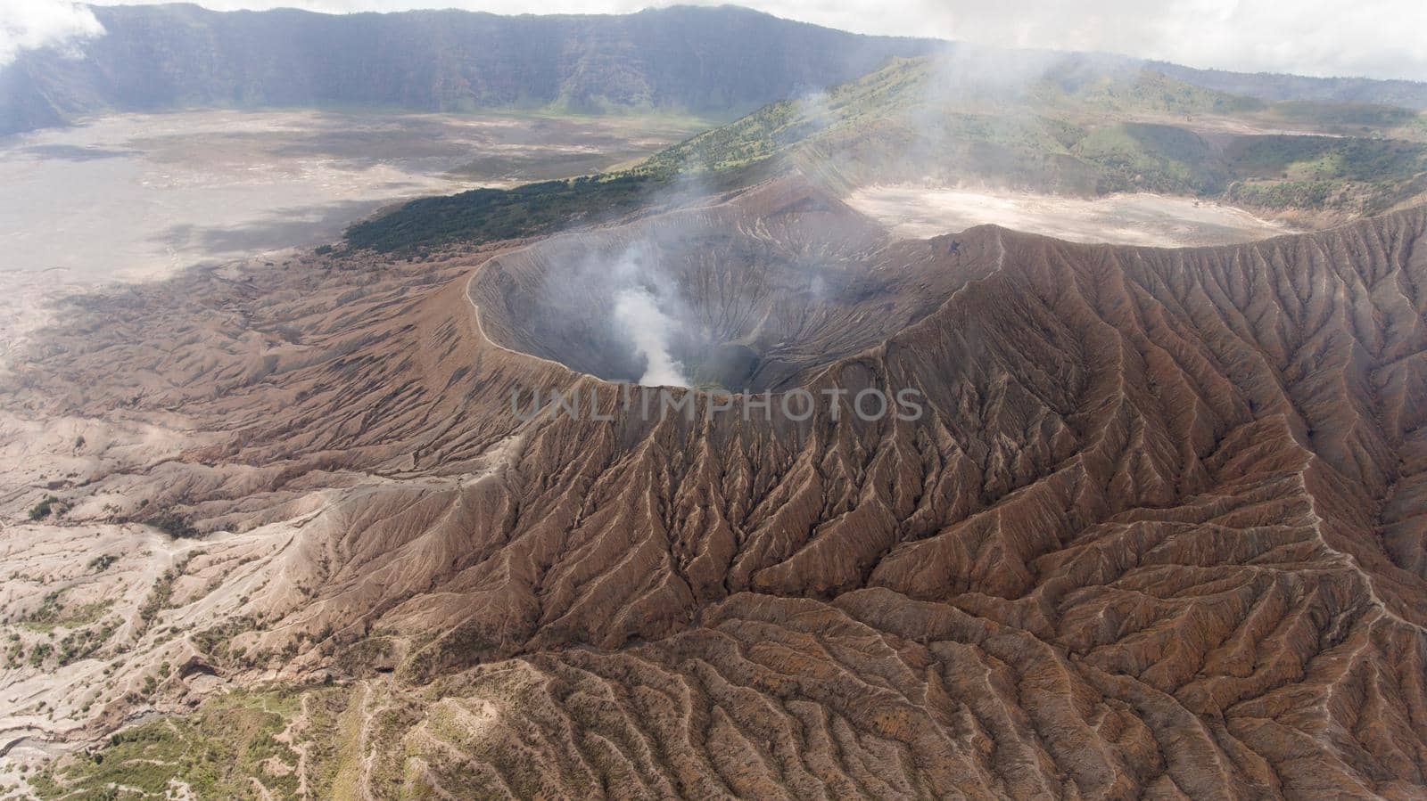 Crater with active volcano smoke in East Jawa, Indonesia. Aerial view of volcano crater Mount Gunung Bromo is an active volcano,Tengger Semeru National Park.