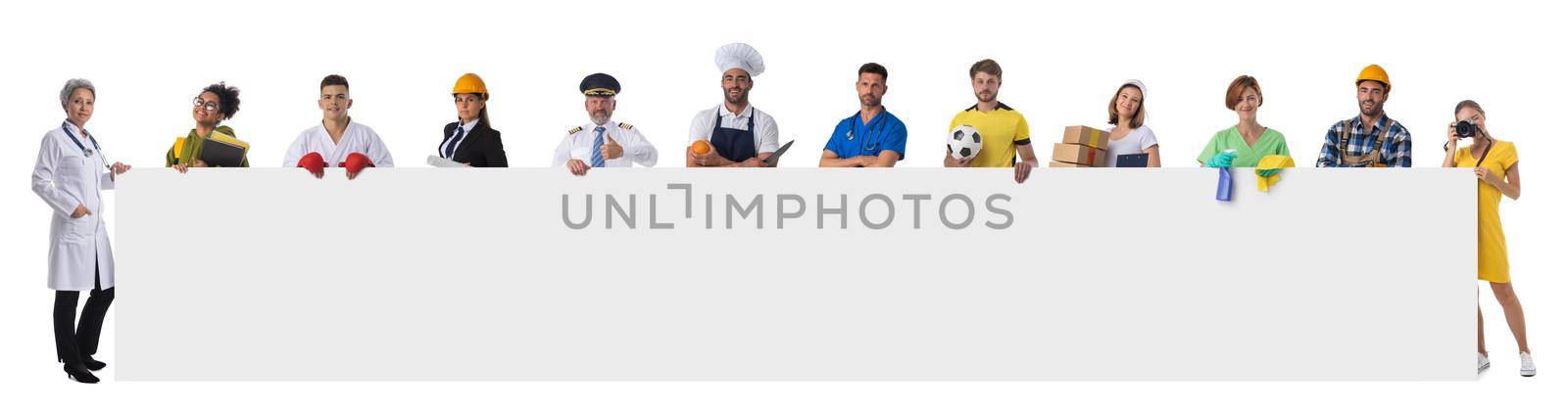 Group of diverse professionals holding blank banner ad isolated on white background