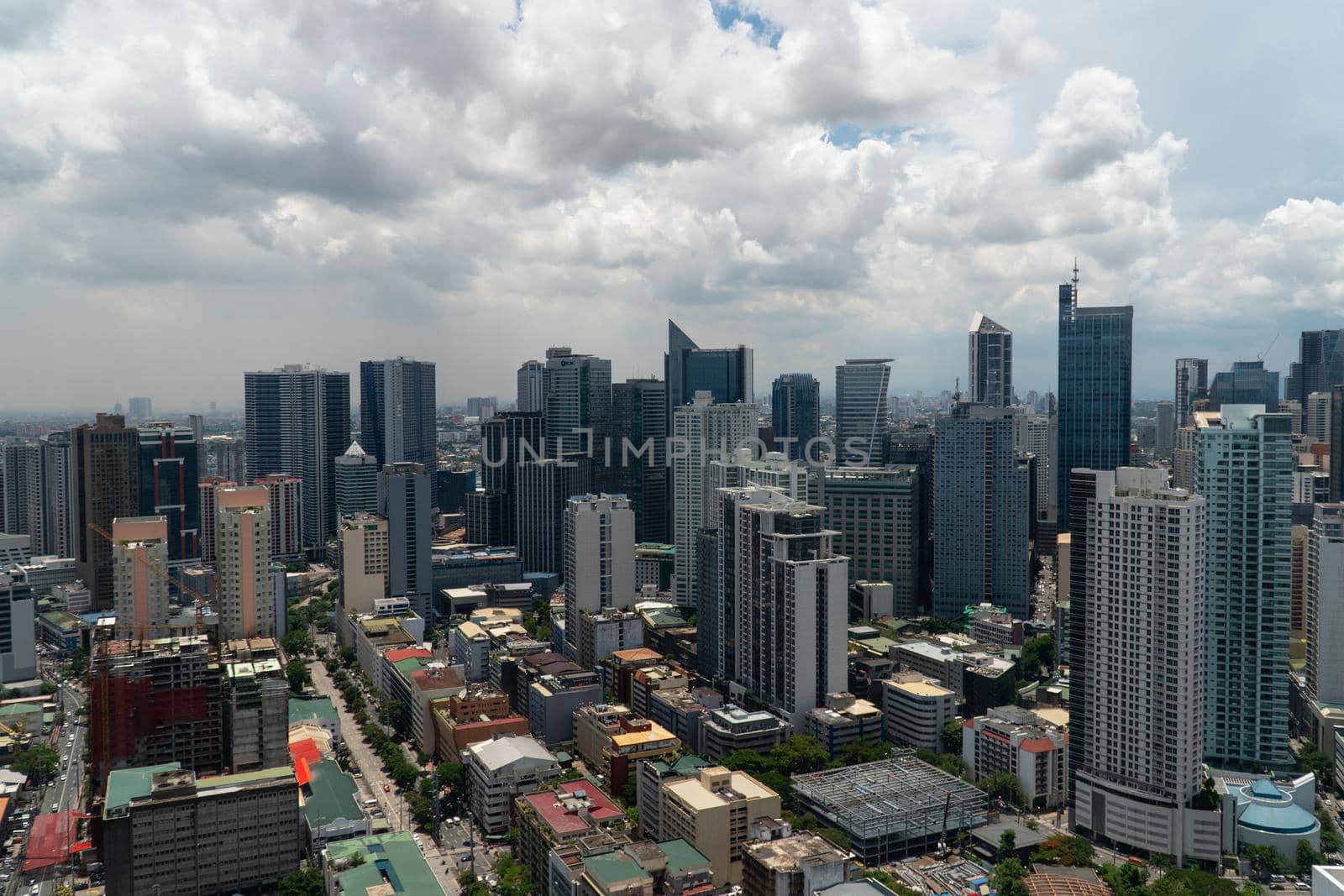 Manila city with skyscrapers, modern buildings and Makati business center. Travel vacation concept.