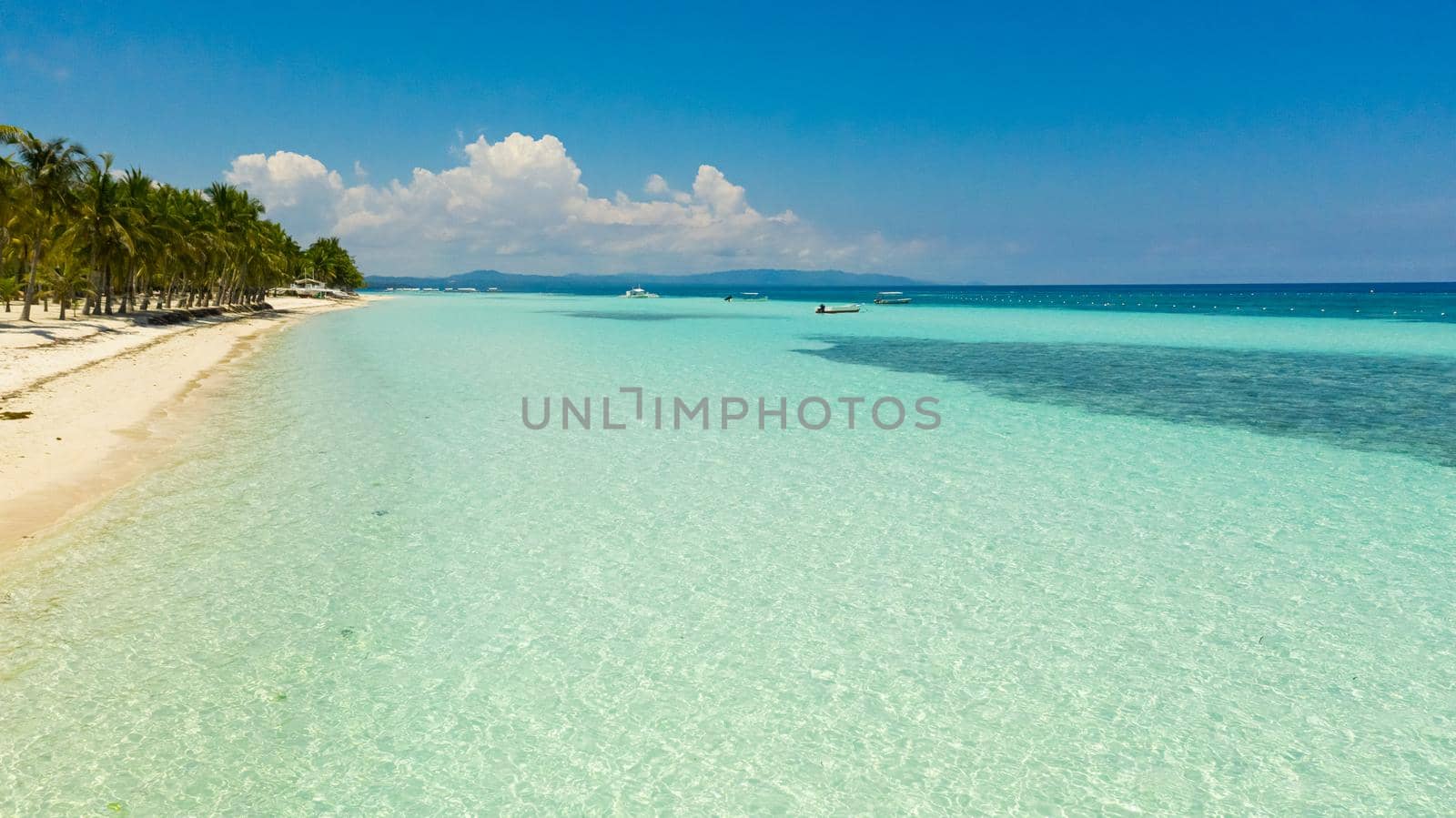Beautiful tropical beach with white sand and turquoise ocean. Panglao island, Bohol, Philippines.