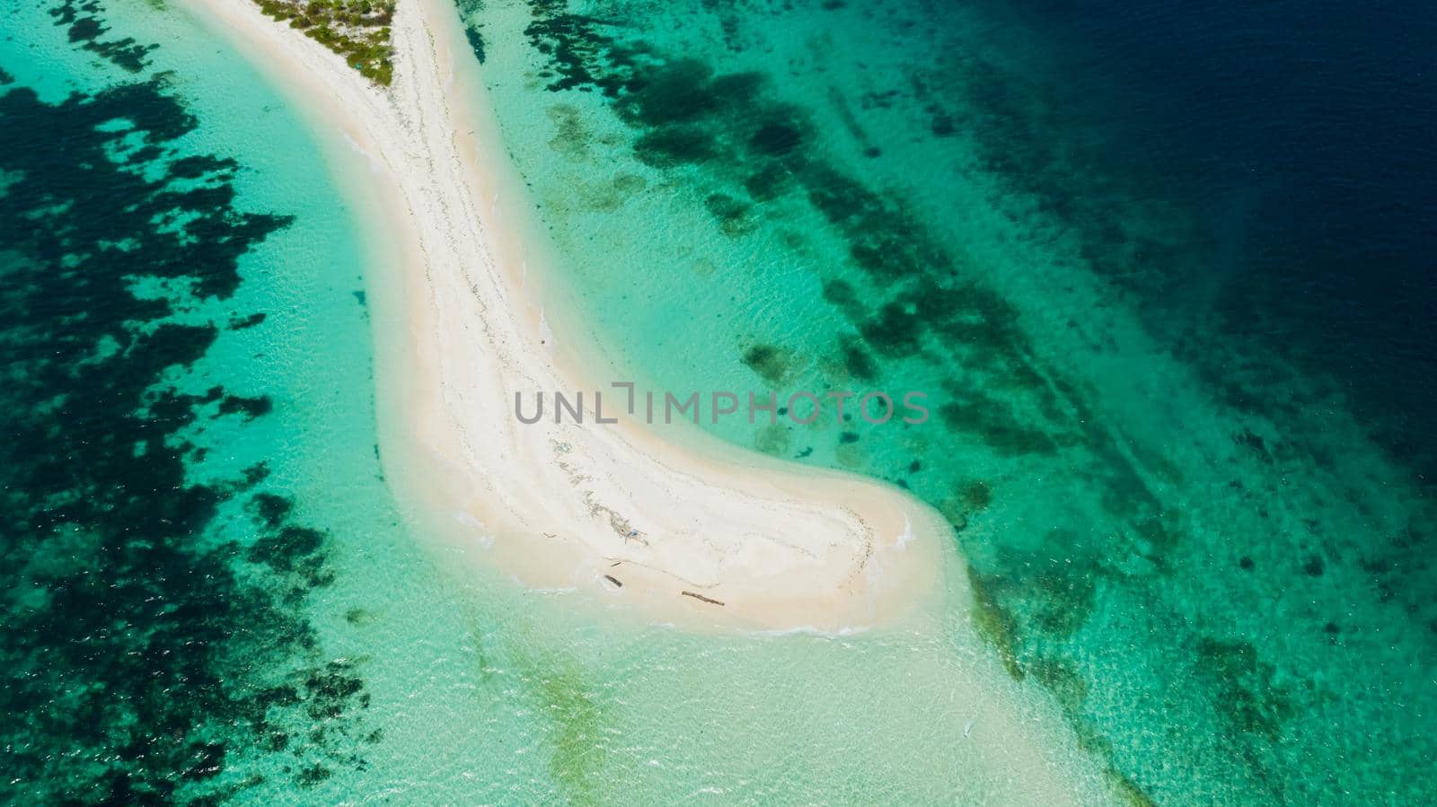 Tropical island with sand beach, top view. Little Santa Cruz Island near Zamboanga city. Mindanao, Philippines.