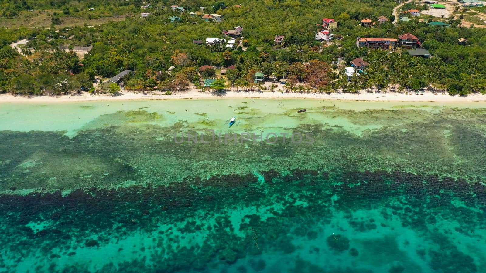 Aerial drone of coast, turquoise sea and sand beach. Panglao island, Bohol, Philippines.
