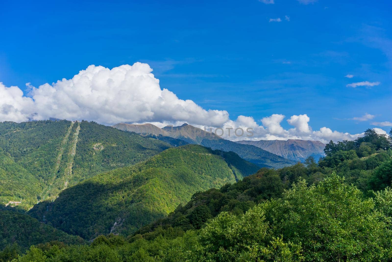 Mountain landscape against cloudy blue sky in Krasnaya Polyana Sochi
