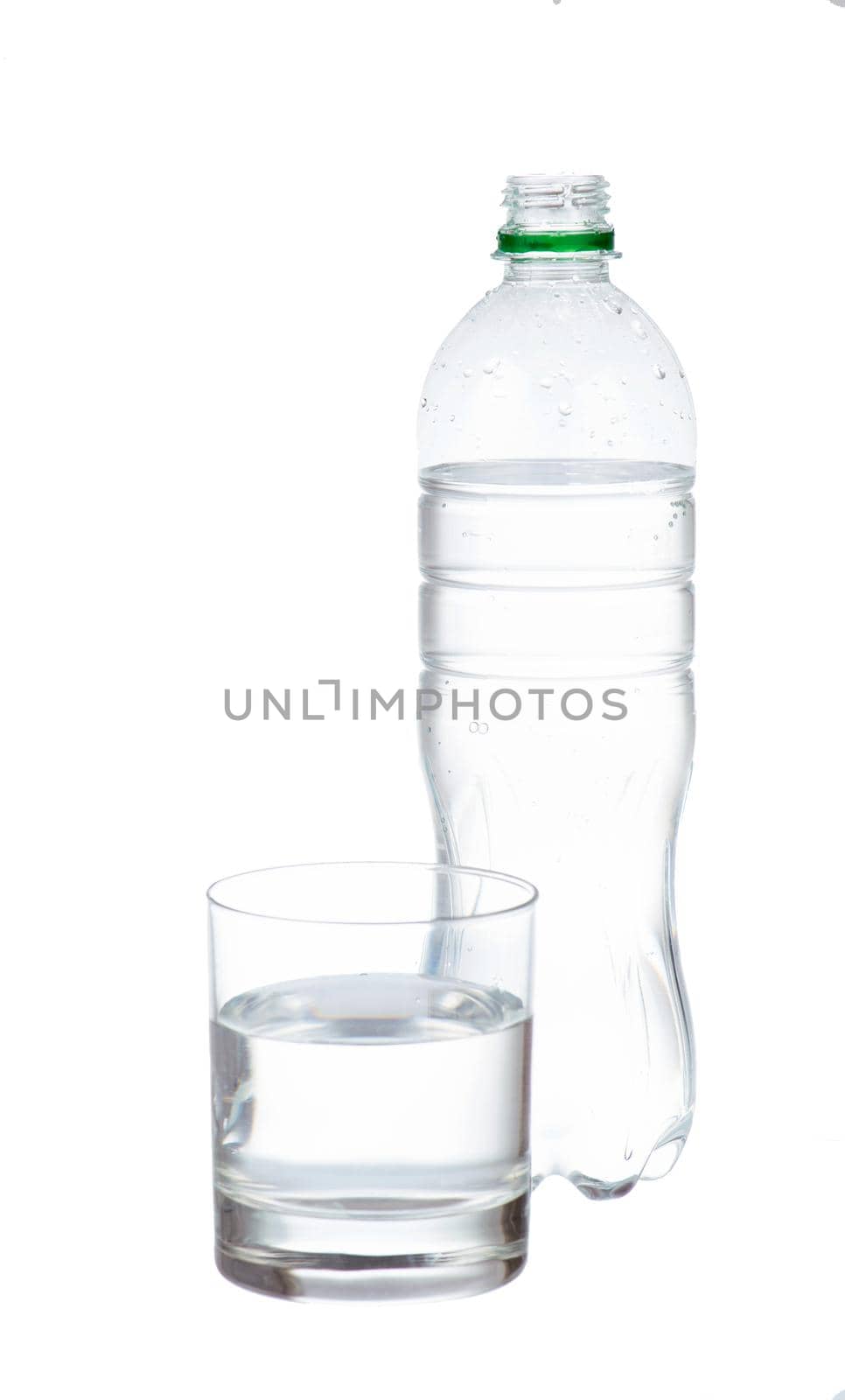 water in plastic bottle with glass isolated by aprilphoto