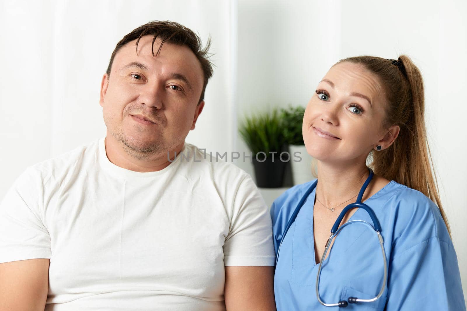 female doctor next to patient hospital care. High quality photo