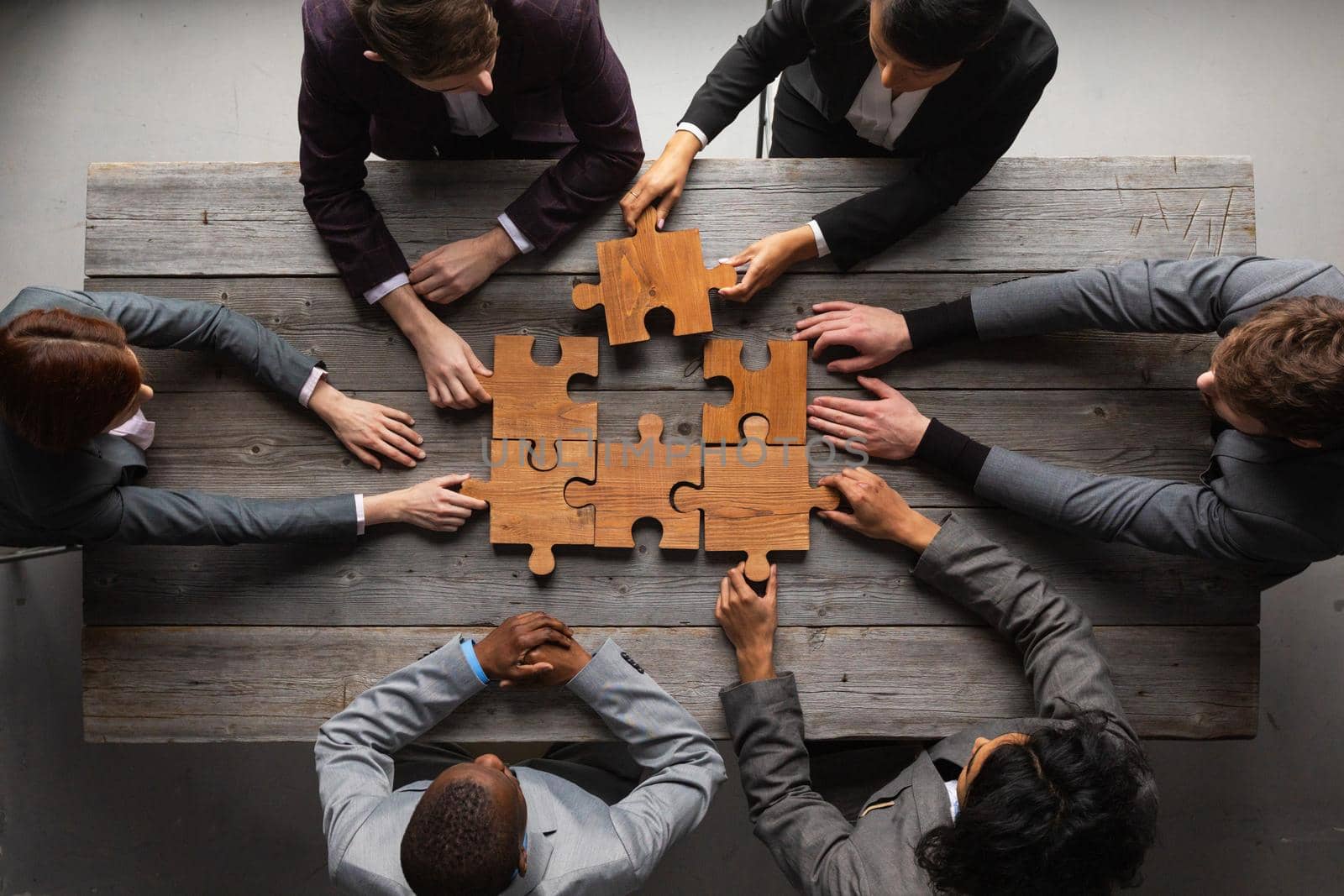 Business teamwork with puzzle by ALotOfPeople