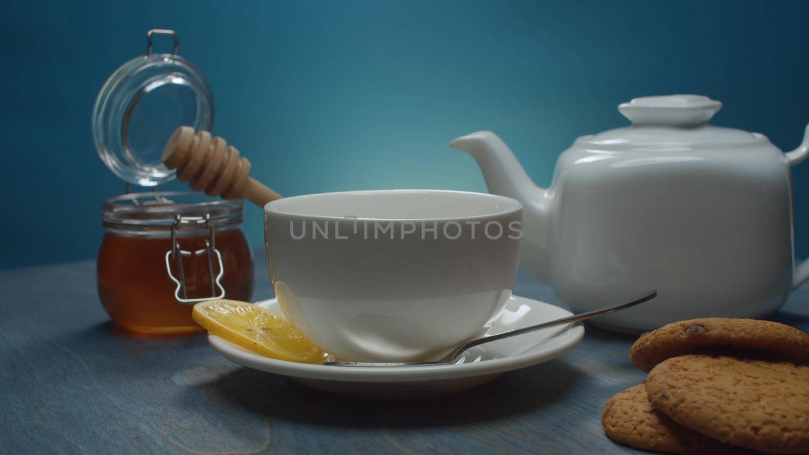Tea pot, tea cup, honey and cookies by Alize