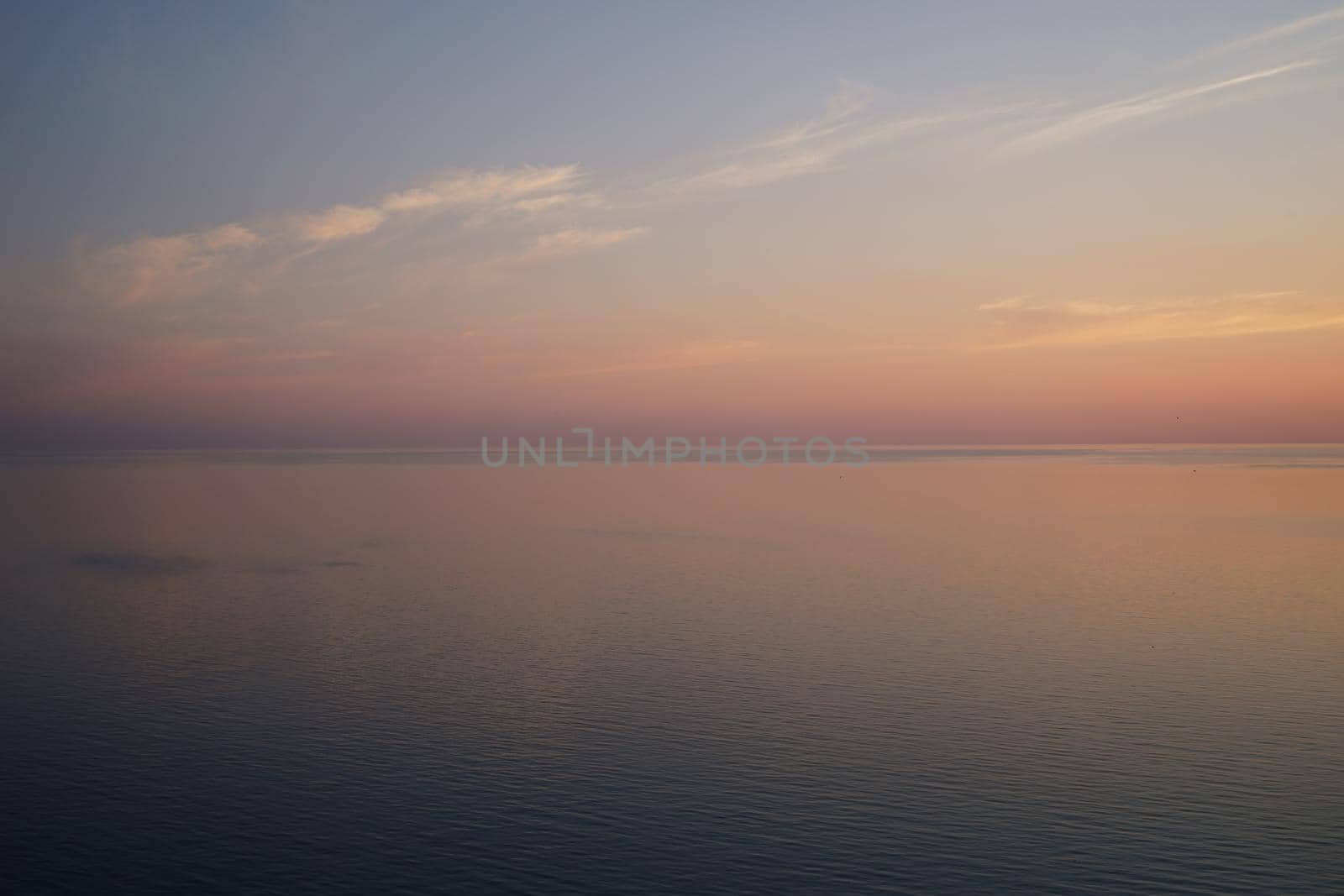 Delicious delicate sunset over a calm sea