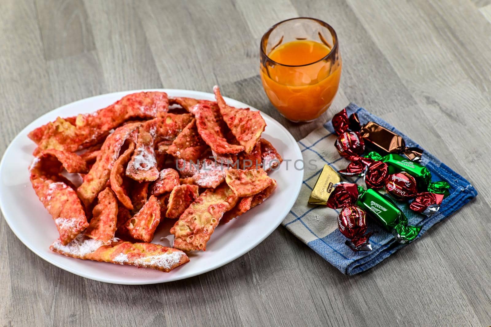 composition of typical carnival dessert, Frappe, fruit juice and chocolates