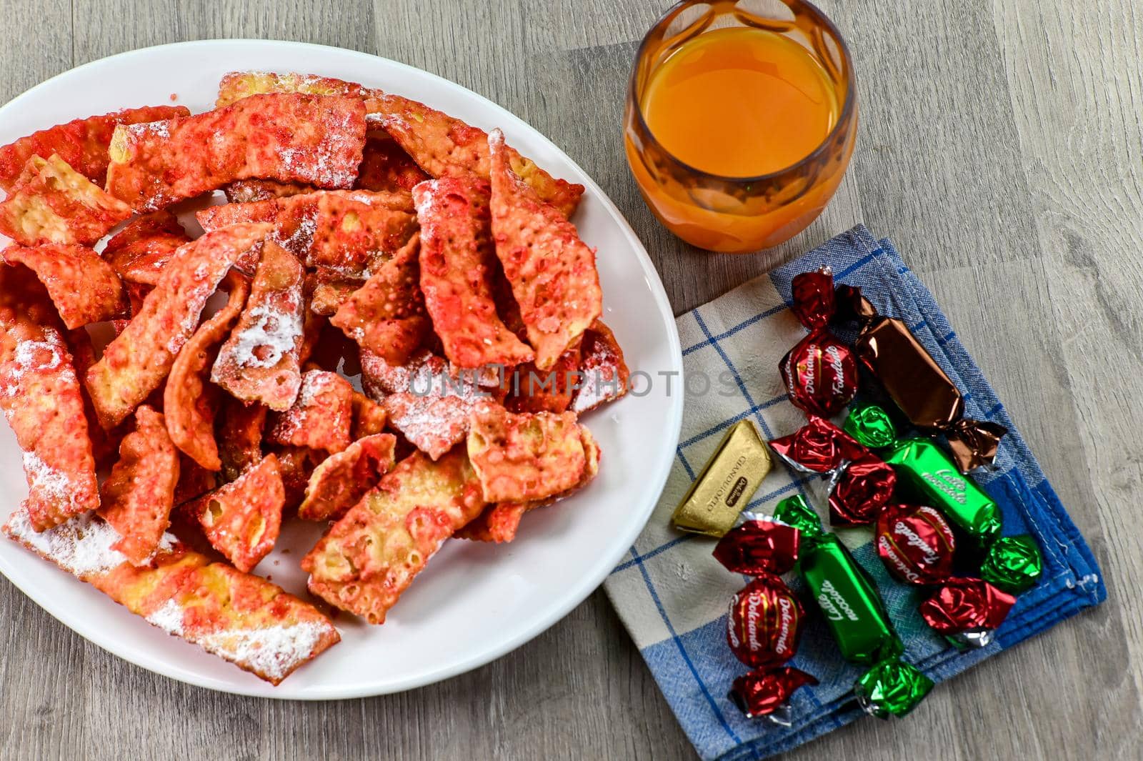 composition of typical carnival dessert, Frappe, fruit juice and chocolates