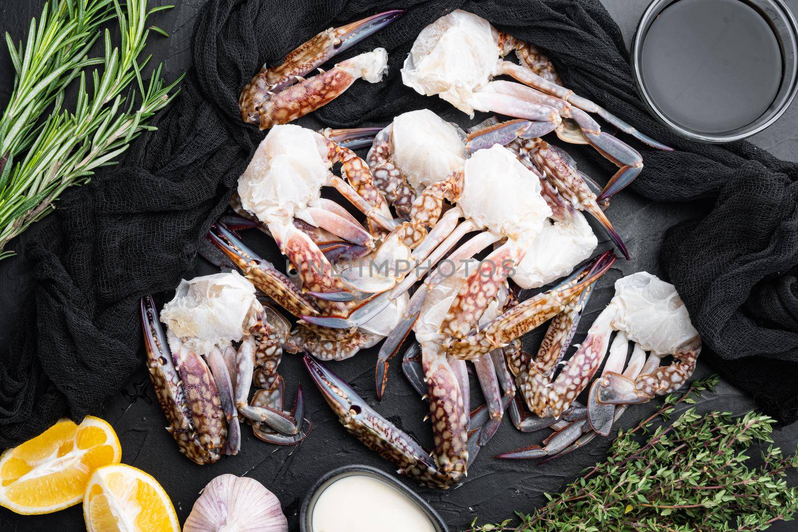 Fresh raw Horse crab, Blue crab, Flower crab set, on black background, top view flat lay