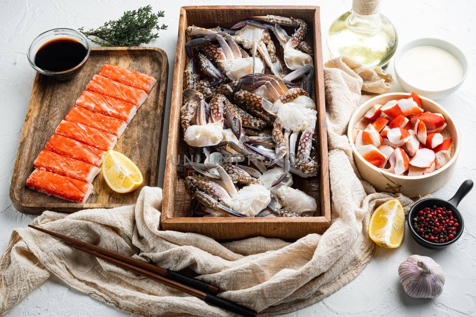 Fresh Crab meat and sticks surimi with blue swimming crab set, on white background
