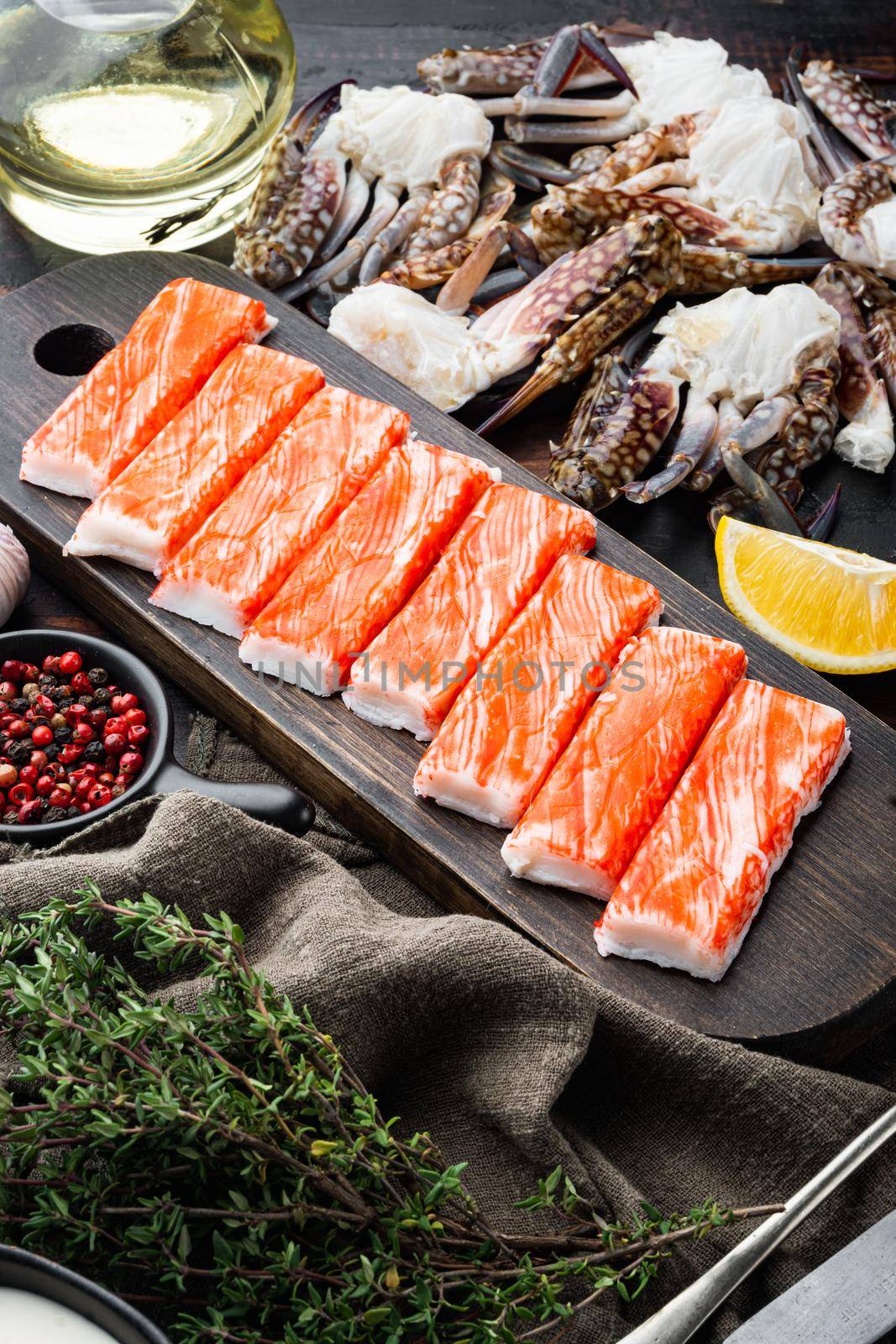 Fresh Crab meat surimi with blue swimming crab set, on dark wooden background