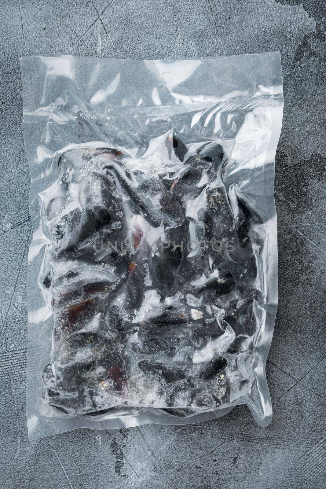 Frozen Mussels vacuum packed set, on gray background, top view flat lay