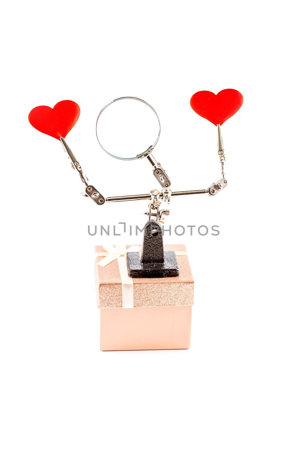 Abstract Valentines Day background with engineering tool third hand holding hearts and gift on white background