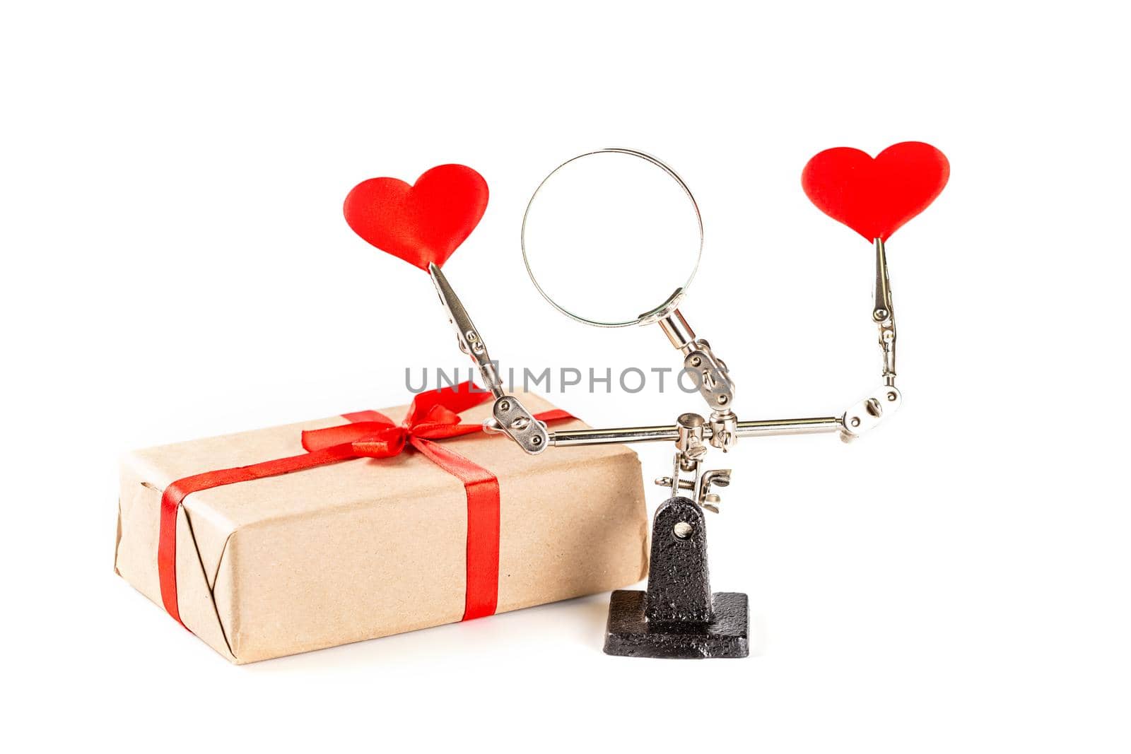 Abstract Valentines Day background with engineering tool third hand holding hearts and gift on white background