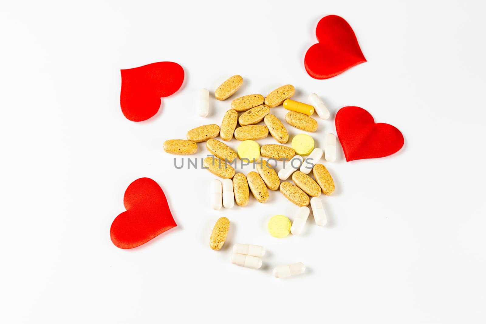 The hearts, tablets and pills isolated on white background by galinasharapova