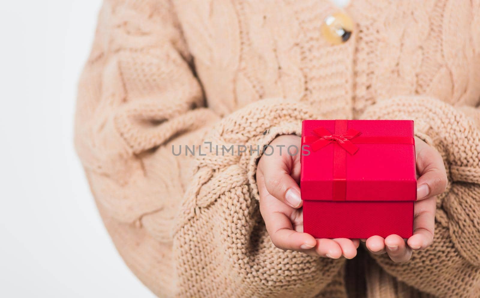 Valentine Day. Woman beauty hands holding small gift package box present wrapped paper with ribbon, Christmas, New year, Birthday holiday background concept