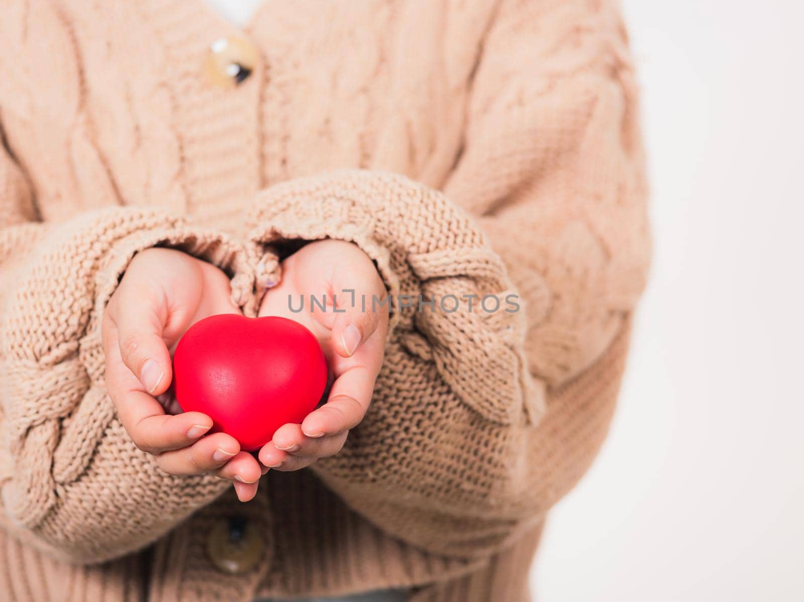 Love Valentine's Day. Woman beauty hands holding red heart for giving help donation medical healthcare concept isolated on white background, holiday background concept
