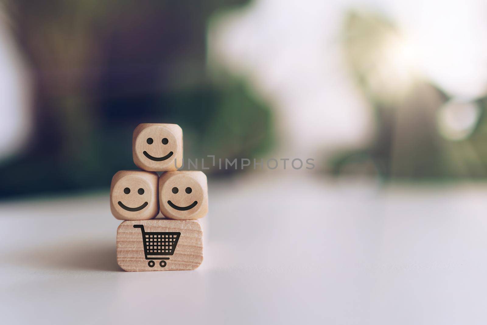 Smile face and cart icon on wooden cube. Optimistic person or people feeling inside and service rating when shopping, satisfaction concept. by Suwant