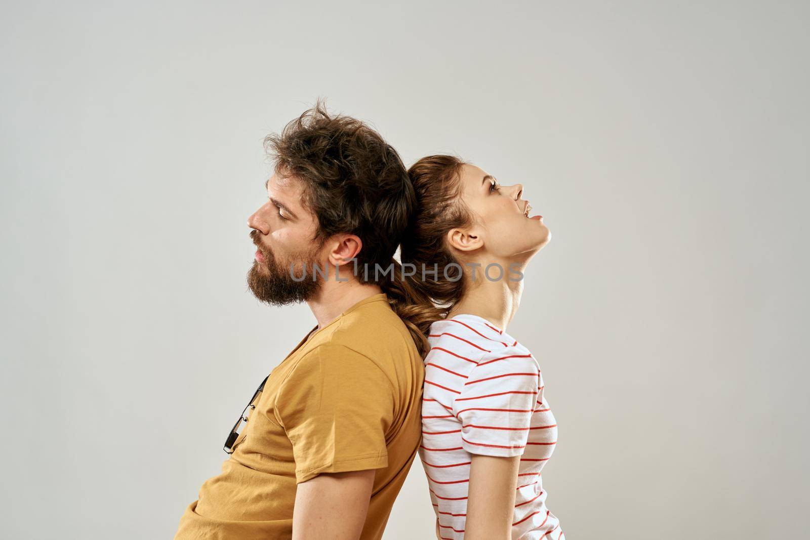 Young couple socializing romance lifestyle fashion fun light background by SHOTPRIME